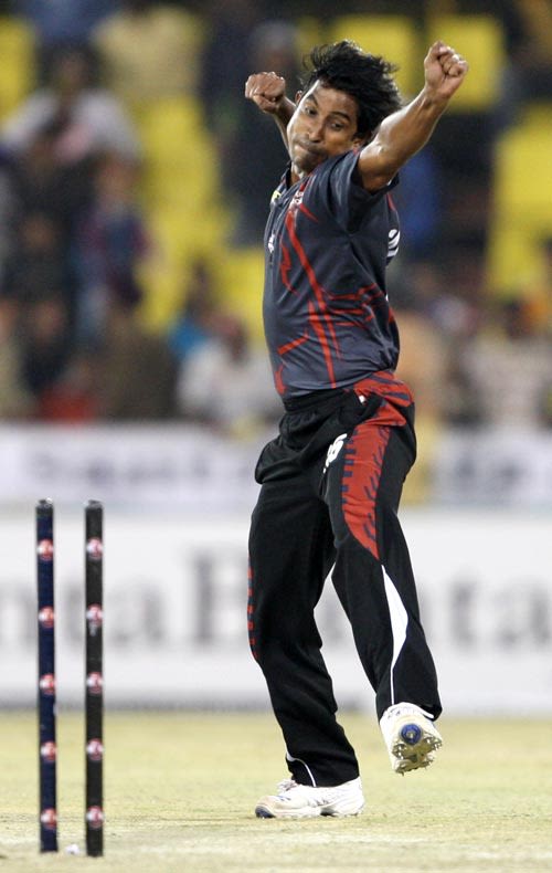 Tapash Baisya celebrates taking a wicket