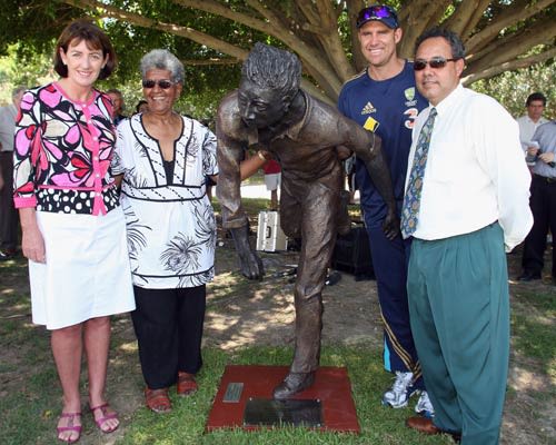 Judy Spence, Valda Coolwell, Matthew Hayden and Larry Budd pose after the unveiling of a statue of Eddie Gilbert