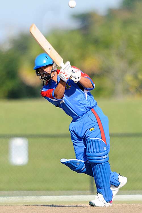 Lionel Cann lofts over midwicket during his hundred against Suriname