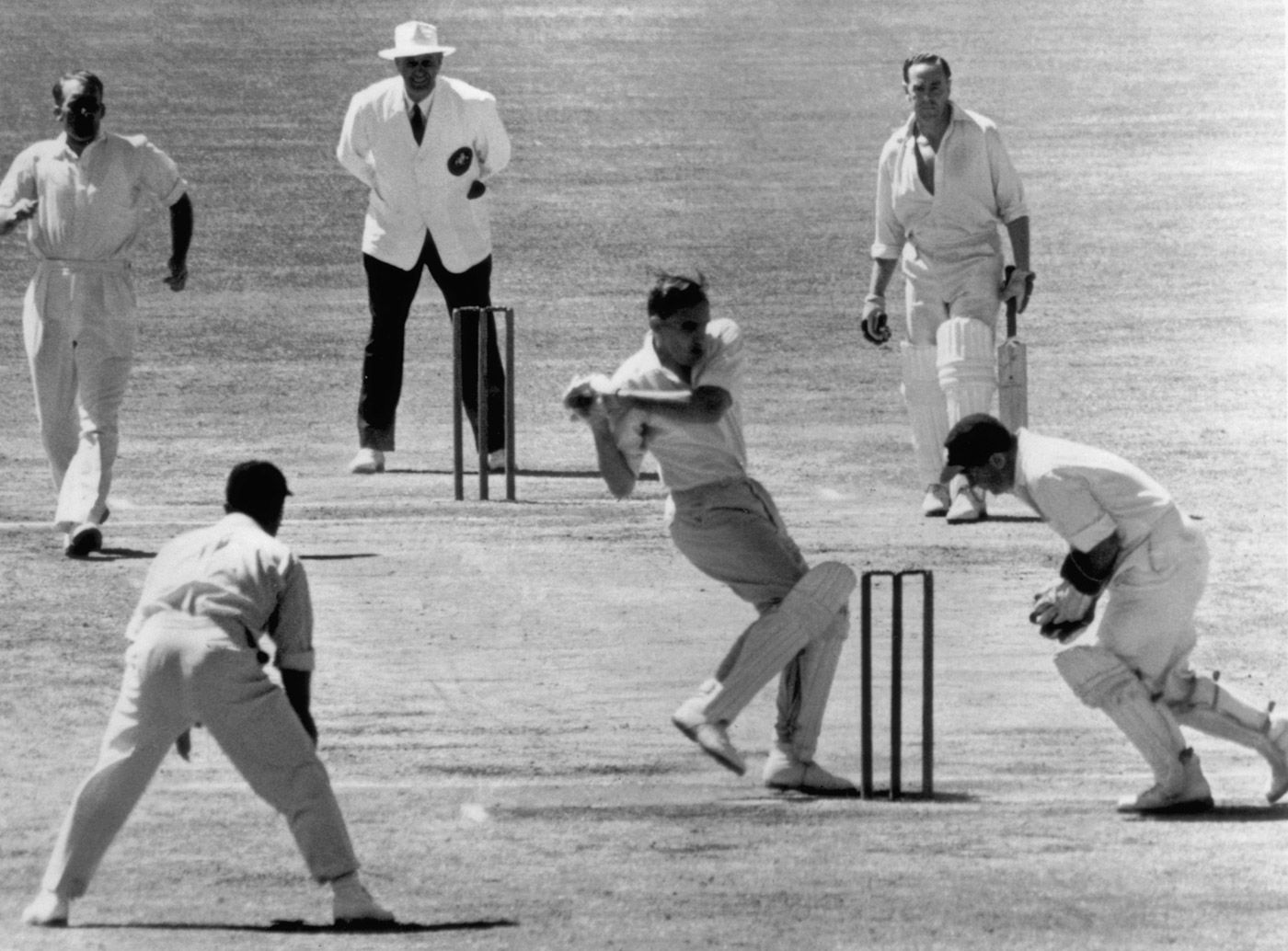 Alan Davidson plays and misses off John Wardle and the ball is caught by keeper Godfrey Evans