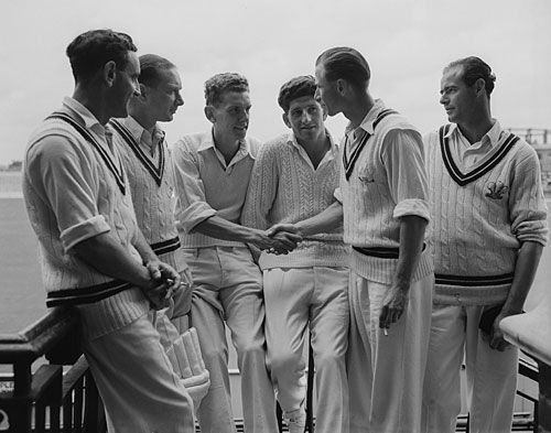 Peter Loader is congratulated by David Fletcher for his 8 for 21