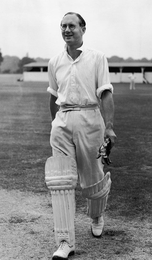 BBC commentator Rex Alston walks back after his innings in a charity game