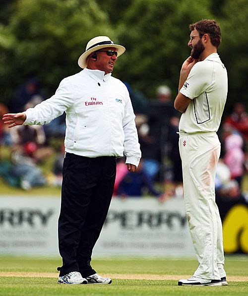 Umpire Mark Benson has a word with Daniel Vettori