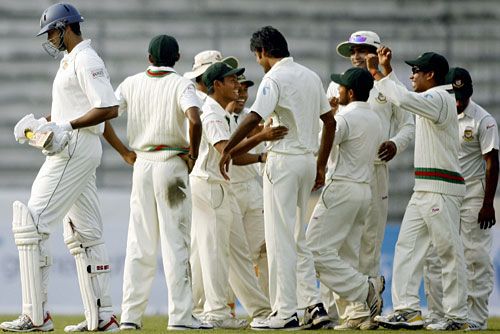 The Bangladesh team celebrates Michael Vandort's dismissal
