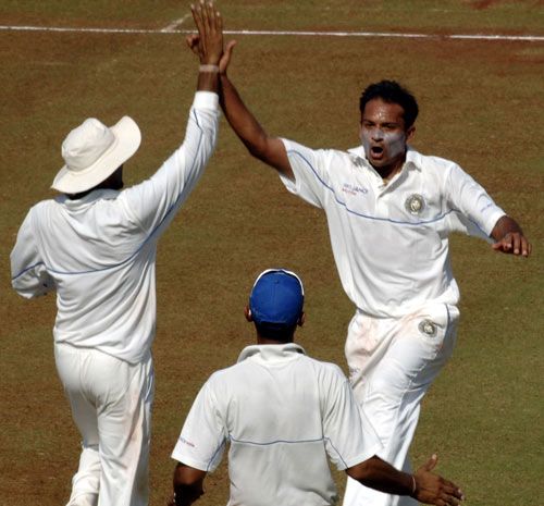 Saurashtra's Sandeep Jobanputra celebrates a wicket