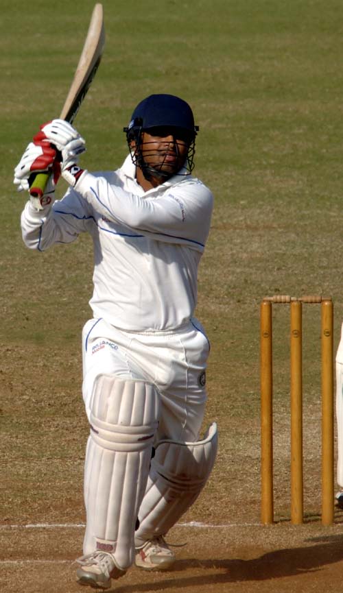 Jaydev Shah attempts to clear the infield 