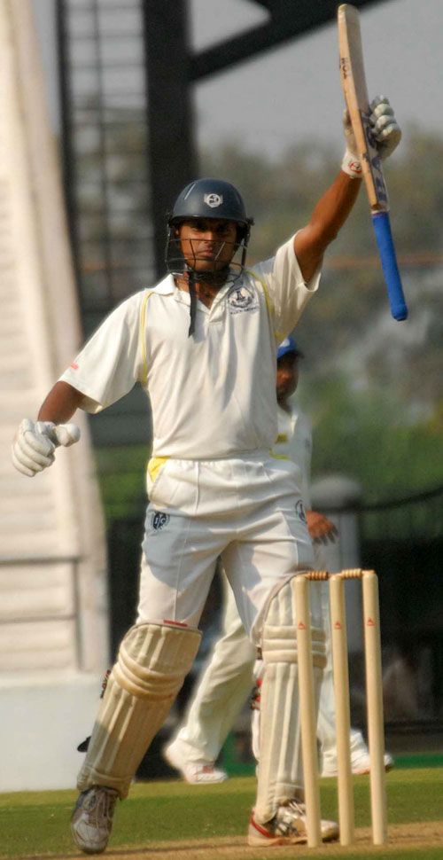 C Ganapathy raises his bat after reaching his half-century