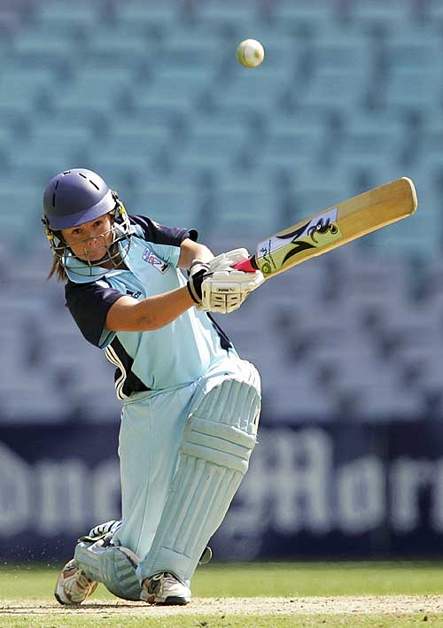 Corinne Hall gives the ball a good hit