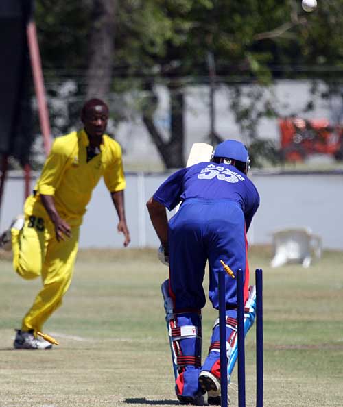 Asghar Stanikzai is bowled by Danniel Ruyange