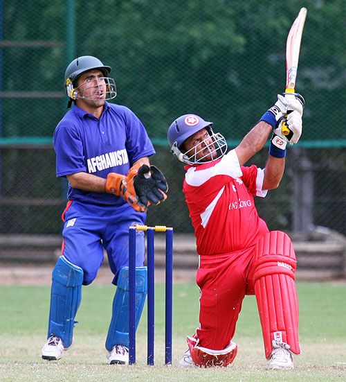 Munir Dar slog-sweeps a six during his 49 for Hong Kong