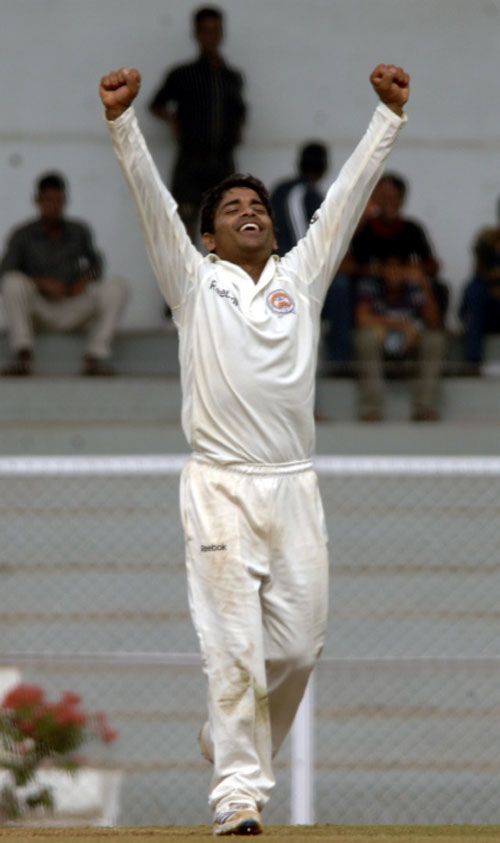 Rajesh Pawar celebrates during his five-wicket haul