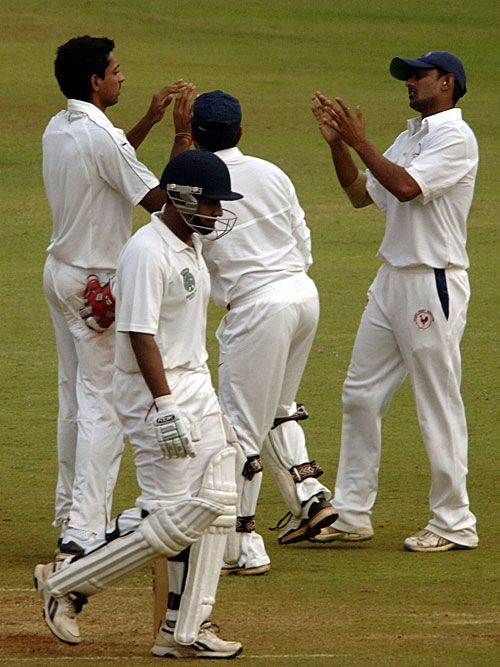 RR Parida walks back for 47 after being dismissed by Dhawal Kulkarni