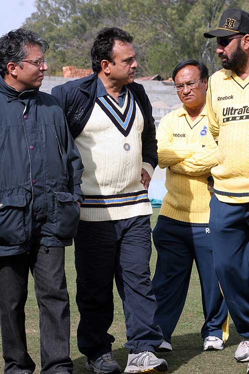 North Zone selector Yashpal Sharma chats with journalists and Delhi coaching staff