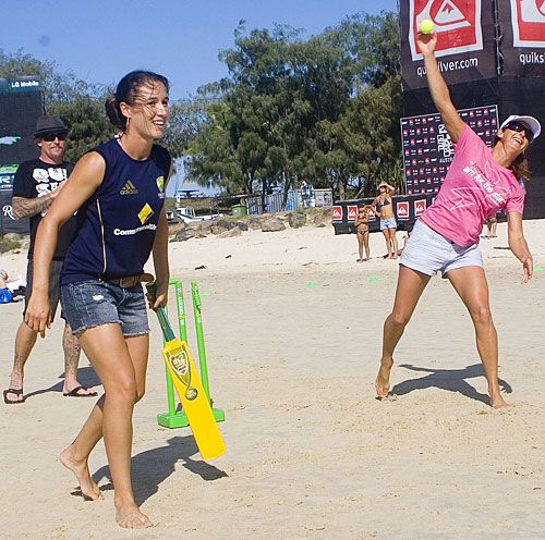 Sarah Andrews is at the non-striker's end as surfer Layne Beachley bowls