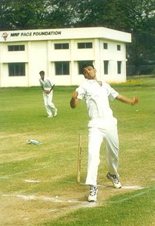 Anup Dave bowling with a classic left arm spinner's action