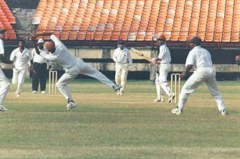 JR Madanagopal about to snap Suresh Kumar at second slip off T Kumaran