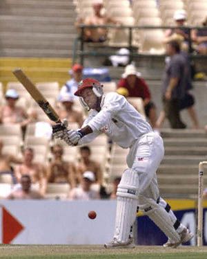 Campbell plays the on drive to a McGrath ball