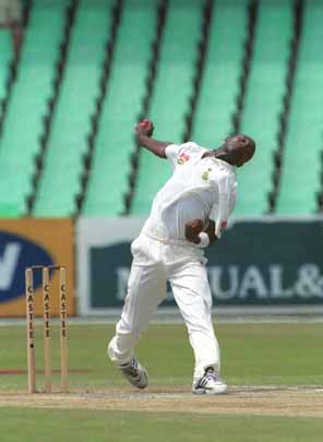 Mfuneko Ngam bowling in the match where he took 3 for 93