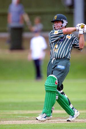 David Kelly hits in the air back past the bowler
