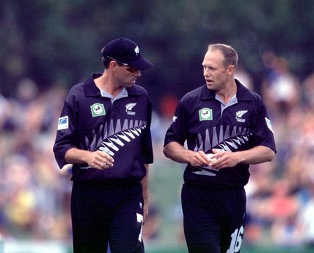 Captain Fleming talks to wayward bowler Penn