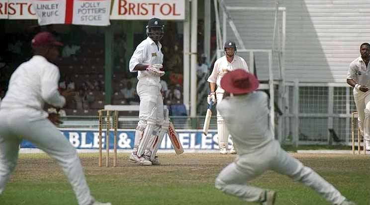 Chris Lewis is caught by Richie Richardson off Kenny Benjamin for 17