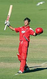 Greg Blewett acknowledges the cheers after his hundred