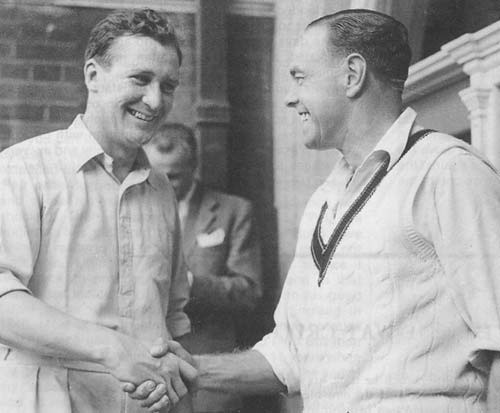 Jim Laker is congratulated by Ian Johnson after taking 19 wickets