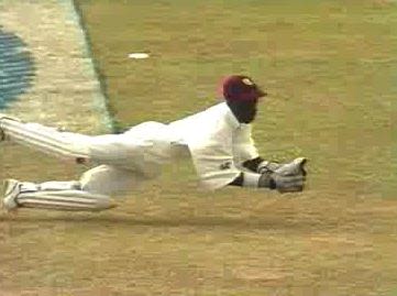 Final day. Williams dives to catch Thorpe