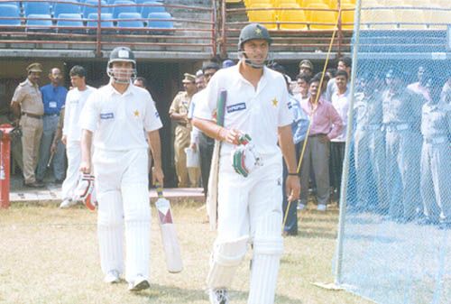 Pakistani opening batsmen Shahid Afridi and Naved Ashraf going in to bat