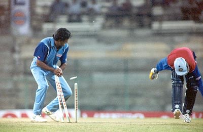 Chopra is caught short of his crease as Srinath breaks the stumps