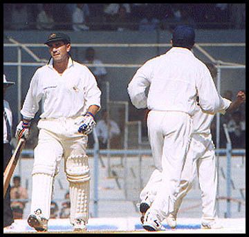A dejected Langer departs after being caught by Mane off Bahutule