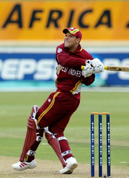 Ricardo Powell watches as he hits one of four sixes against Bangladesh