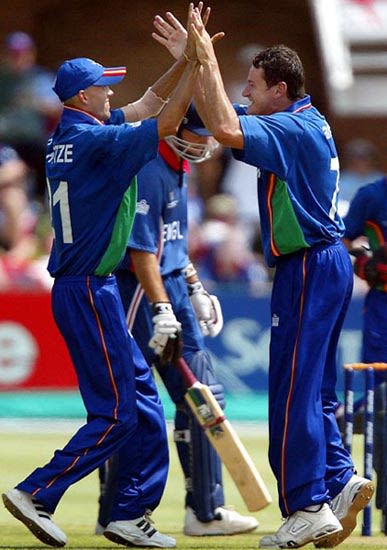 Bjorn Kotze and Rudi Van Vuuren celebrate taking the wicket of Michael Vaughan