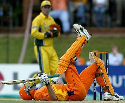 Roland Lefebvre lies on his back after avoiding a bouncer from Andy Bichel