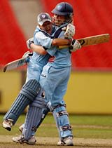 Leonie Coleman and Alex Blackwell of New South Wales celebrate hitting the winning runs to defeat Victoria in the Womens National Cricket League 3rd Final