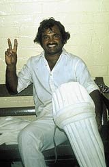 Mushtaq Mohammad gives the victory sign in the dressing room after a match