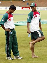 Hannan Sarker and Mushfiqur Rahman inspect the outfield at Bulawayo