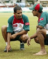 Hannan Sarker and Mushfiqur Rahman inspect the outfield at Bulawayo