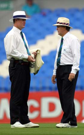 Umpires consult over the second morning weather conditions