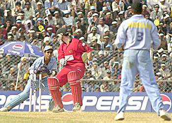 Ajay Ratra stumps Travis Friend off Harbhajan Singh at Guwahati