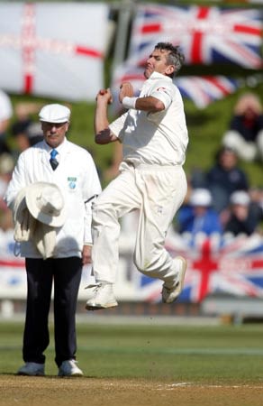 Caddick delivers a ball as umpire Dunne looks on. 2nd Test: New Zealand v England at Wellington, 21-25 Mar 2002