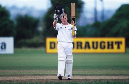 Horsley raises his helmet and bat to celebrate reaching his century. State Championship: Auckland v Wellington at Auckland, 24-27 Mar 2002