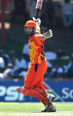 Netherland's batsman Jan Kloppenburg celebrates scoring the team's first ever century in one-day cricket