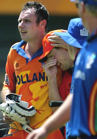 An emotional Klaas-Jan van Noortwijke is embraced by team mate Lucas van Troost
