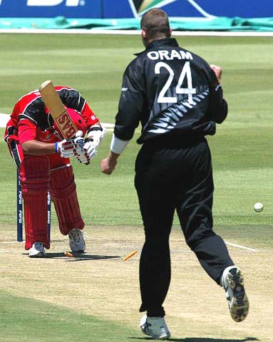 Canada's Austin Codrington looks down after being bowled out by New Zealands bowler Jacob Oram