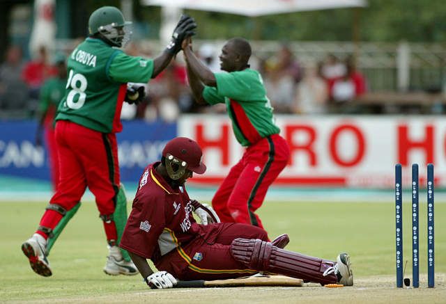 Kennedy Obuya and Joseph Angara celebrate after Obuya stumped Carl Hooper
