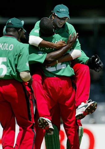 Ravindu Shah jumps into the arms of team-mate Collins Obuya after Streak was caught for a duck