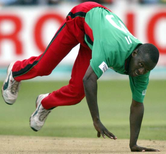 Martin Suji loses his balance and falls over during the semi-final against India at Durban