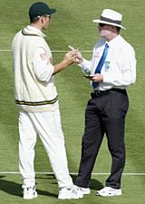 Graeme Smith and Russell Tiffin exchange views after Andre Nel had been warned for running down the wicket