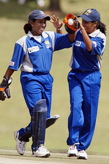 Thanuga Ekanayake and Inoka Galagedara celebrate a run out